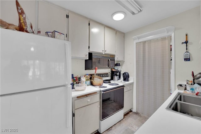 5083 Village Dr, Las Vegas, NV 89142 - kitchen featuring white appliances and light countertops