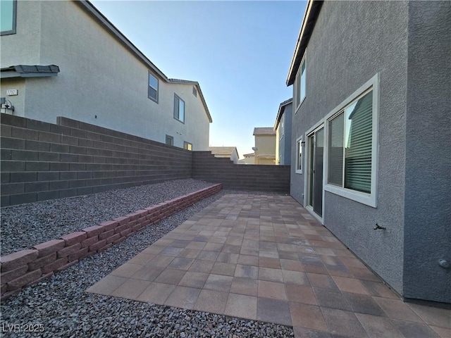 5817 Bonita Rose St, Las Vegas, NV 89113 - fenced backyard with a patio area
