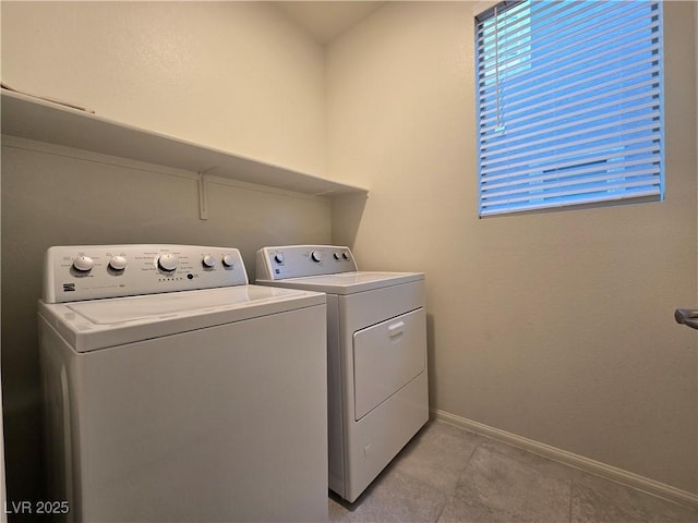 5817 Bonita Rose St, Las Vegas, NV 89113 - laundry room featuring washer and clothes dryer and light tile patterned flooring