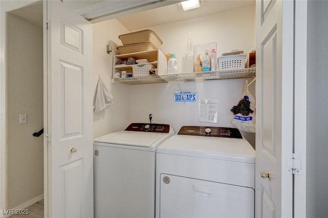 2925 Wigwam Pkwy Unit 123, Henderson, NV 89074 - laundry area featuring washing machine and clothes dryer and baseboards