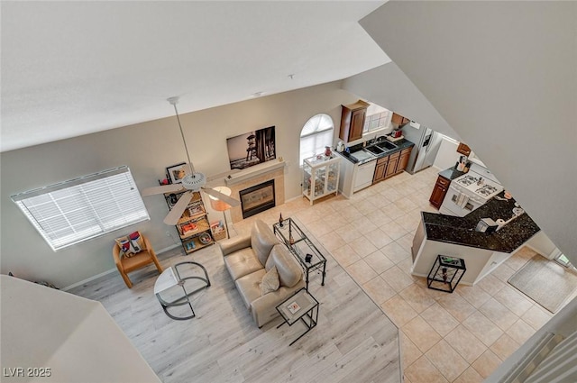 2925 Wigwam Pkwy Unit 123, Henderson, NV 89074 - living area with light wood finished floors and a fireplace