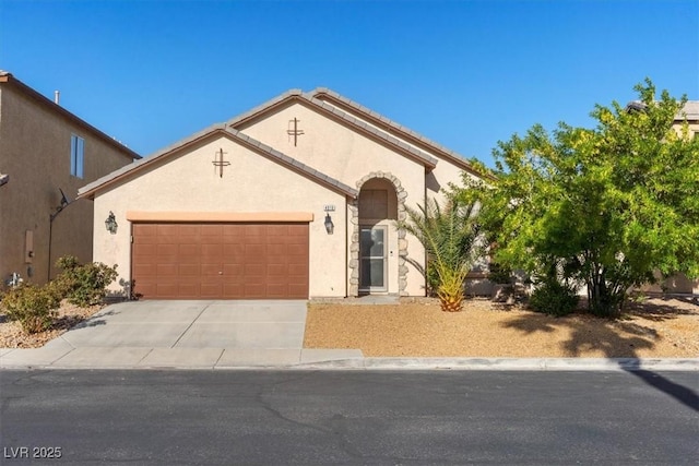 4916 White Jade St, North Las Vegas, NV 89081 - view of front of home featuring an attached garage, stucco siding, and concrete driveway