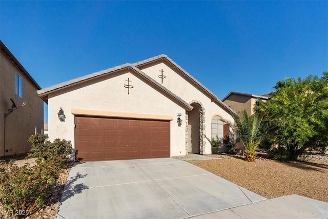 4916 White Jade St, North Las Vegas, NV 89081 - view of front of property featuring an attached garage, driveway, and stucco siding