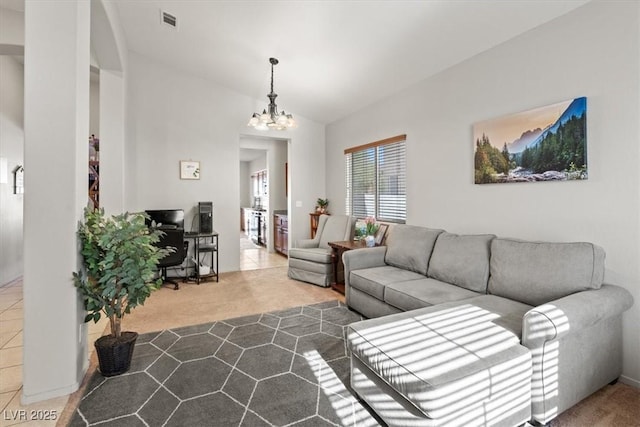 4916 White Jade St, North Las Vegas, NV 89081 - carpeted living room featuring a chandelier and vaulted ceiling