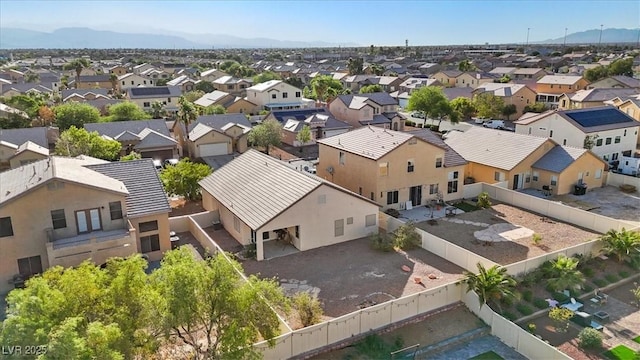 4916 White Jade St, North Las Vegas, NV 89081 - aerial perspective of suburban area with a mountain backdrop