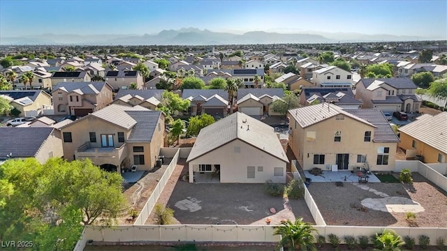 4916 White Jade St, North Las Vegas, NV 89081 - aerial perspective of suburban area with a mountainous background
