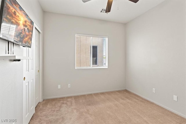 4916 White Jade St, North Las Vegas, NV 89081 - unfurnished bedroom with light carpet, a closet, and ceiling fan
