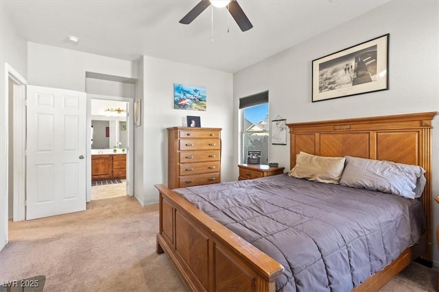 4916 White Jade St, North Las Vegas, NV 89081 - bedroom featuring light colored carpet, ensuite bathroom, and a ceiling fan