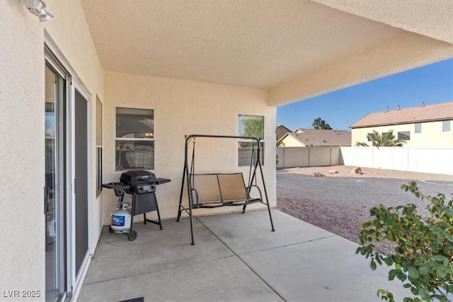 4916 White Jade St, North Las Vegas, NV 89081 - fenced backyard with area for grilling and a patio area