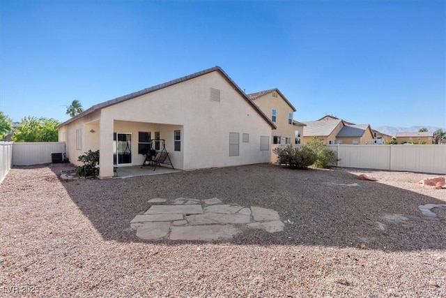 4916 White Jade St, North Las Vegas, NV 89081 - rear view of house featuring a fenced backyard, a patio, and stucco siding