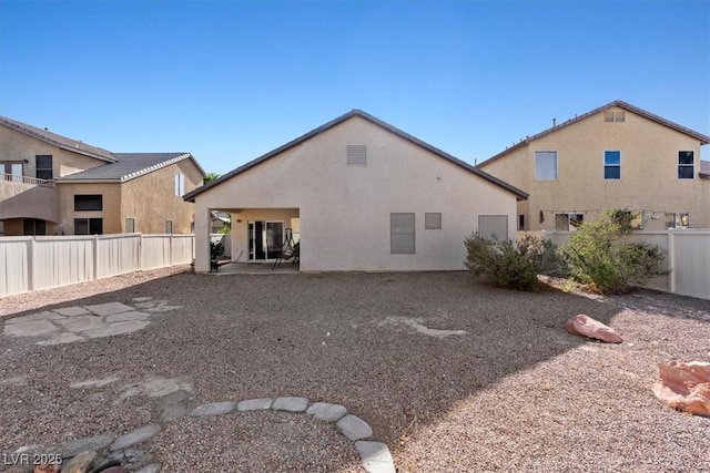 4916 White Jade St, North Las Vegas, NV 89081 - rear view of house featuring a fenced backyard and stucco siding