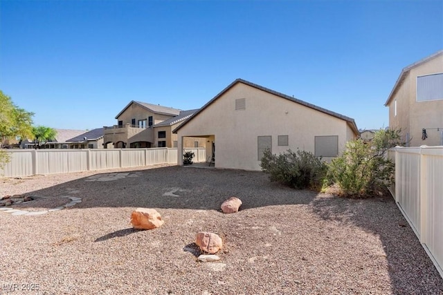 4916 White Jade St, North Las Vegas, NV 89081 - rear view of house featuring a fenced backyard and stucco siding