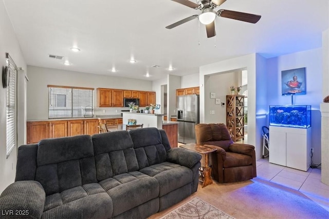 4916 White Jade St, North Las Vegas, NV 89081 - living room featuring a ceiling fan and light tile patterned floors