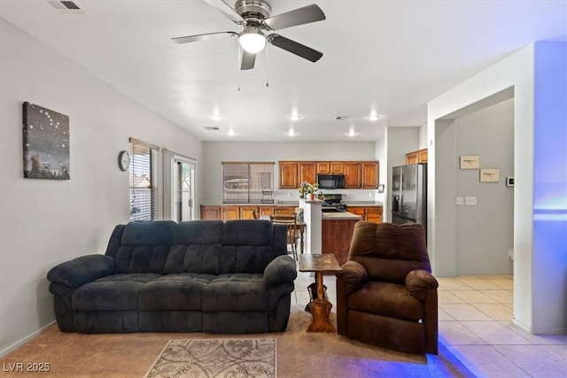 4916 White Jade St, North Las Vegas, NV 89081 - living area featuring ceiling fan and light tile patterned flooring