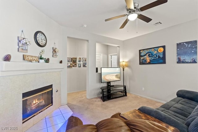 4916 White Jade St, North Las Vegas, NV 89081 - carpeted living area featuring ceiling fan and a fireplace