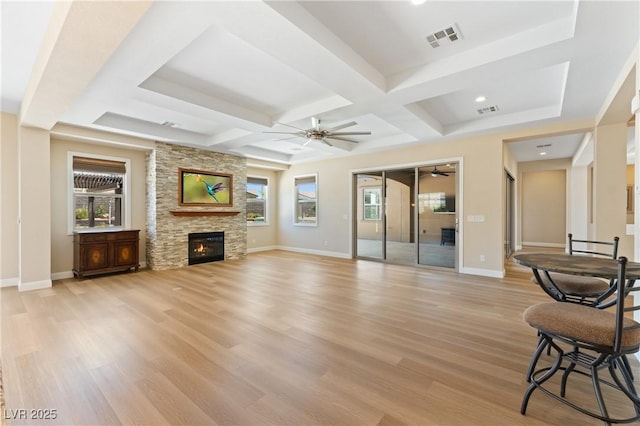 12168 Dorada Coast Ave, Las Vegas, NV 89138 - unfurnished living room featuring a ceiling fan, plenty of natural light, coffered ceiling, light wood-style flooring, and beamed ceiling
