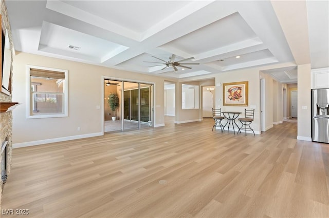 12168 Dorada Coast Ave, Las Vegas, NV 89138 - unfurnished living room with coffered ceiling, ceiling fan, light wood-type flooring, a stone fireplace, and beam ceiling