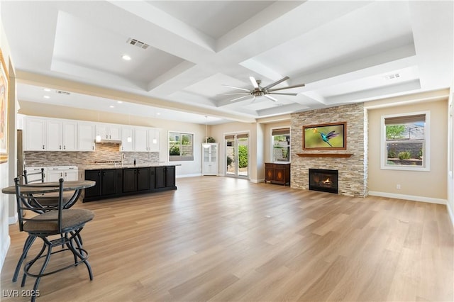 12168 Dorada Coast Ave, Las Vegas, NV 89138 - living room featuring light wood-style floors, ceiling fan, a fireplace, coffered ceiling, and recessed lighting
