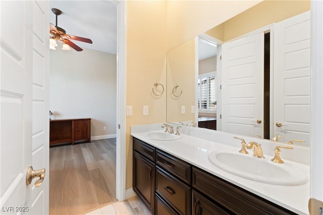 12168 Dorada Coast Ave, Las Vegas, NV 89138 - full bathroom featuring double vanity, wood finished floors, and ceiling fan