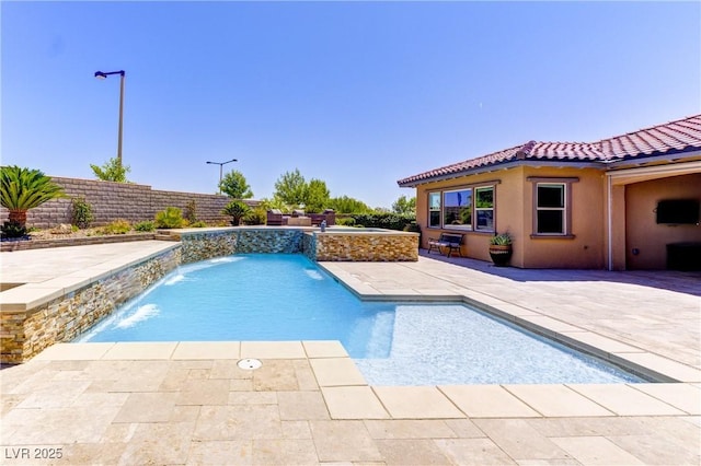 12168 Dorada Coast Ave, Las Vegas, NV 89138 - view of pool with a patio area, a fenced backyard, and a pool with connected hot tub