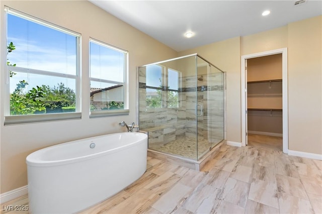 12168 Dorada Coast Ave, Las Vegas, NV 89138 - full bath featuring a freestanding bath, a stall shower, recessed lighting, and a spacious closet