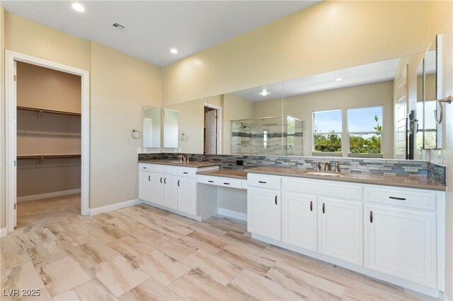 12168 Dorada Coast Ave, Las Vegas, NV 89138 - bathroom with a shower stall, tasteful backsplash, vanity, recessed lighting, and a spacious closet