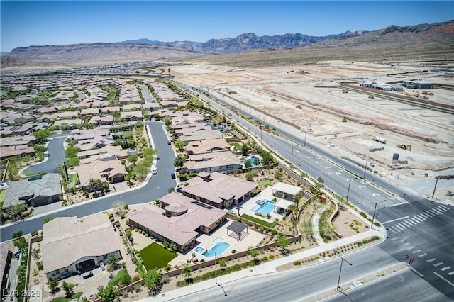 12168 Dorada Coast Ave, Las Vegas, NV 89138 - aerial perspective of suburban area with a mountainous background and a pool area