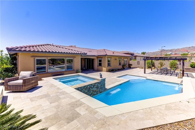 12168 Dorada Coast Ave, Las Vegas, NV 89138 - view of swimming pool with a patio area, a fenced backyard, and a pool with connected hot tub