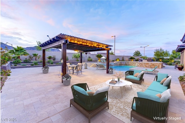 12168 Dorada Coast Ave, Las Vegas, NV 89138 - fenced backyard featuring a pergola, an outdoor hangout area, and a patio area