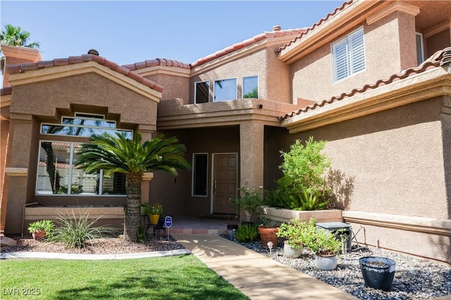 2208 Fiero Dr, Las Vegas, NV 89134 - entrance to property with a tile roof and stucco siding