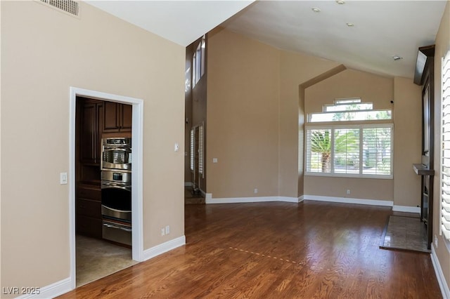 2208 Fiero Dr, Las Vegas, NV 89134 - unfurnished room featuring wood finished floors and a towering ceiling