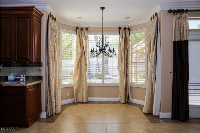 2208 Fiero Dr, Las Vegas, NV 89134 - unfurnished dining area with a chandelier, plenty of natural light, and crown molding