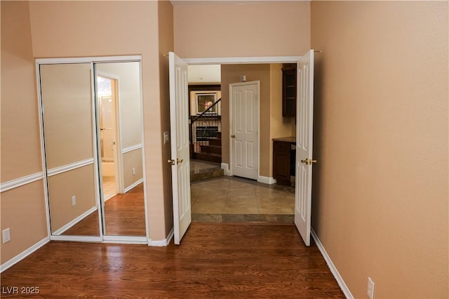 2208 Fiero Dr, Las Vegas, NV 89134 - corridor featuring dark wood finished floors and baseboards
