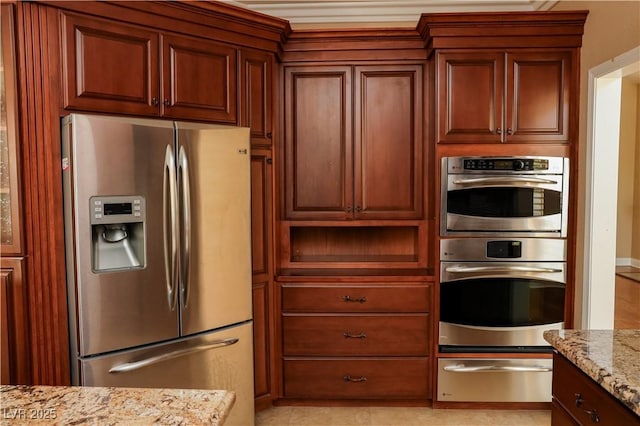 2208 Fiero Dr, Las Vegas, NV 89134 - kitchen with appliances with stainless steel finishes, a warming drawer, and light stone counters