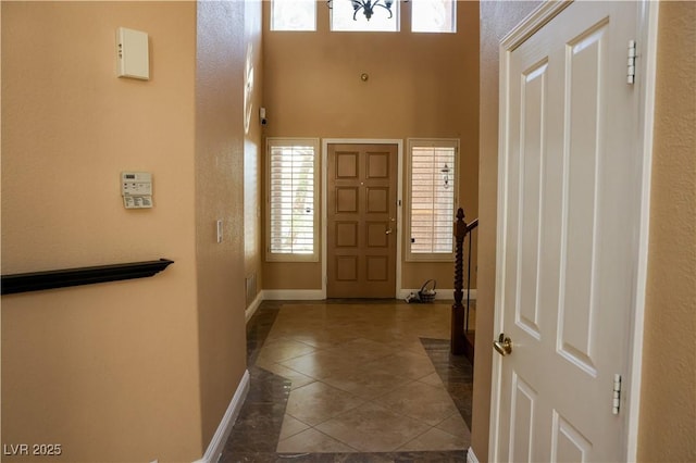 2208 Fiero Dr, Las Vegas, NV 89134 - entryway featuring tile patterned flooring and a towering ceiling