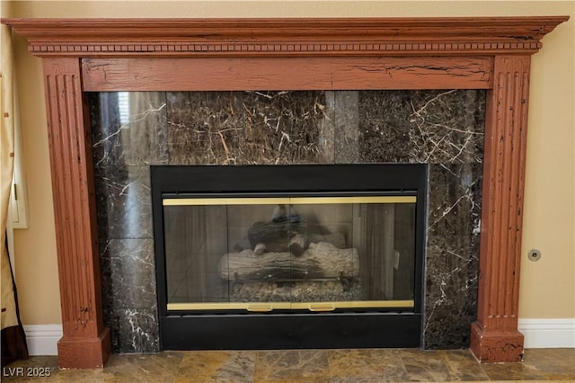 2208 Fiero Dr, Las Vegas, NV 89134 - detailed view of a high end fireplace and baseboards