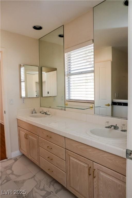 2208 Fiero Dr, Las Vegas, NV 89134 - bathroom featuring double vanity and marble finish flooring