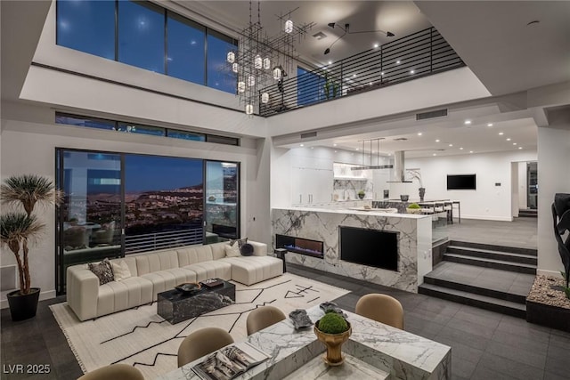 1491 Reims Dr, Henderson, NV 89012 - living area featuring a high ceiling and a chandelier