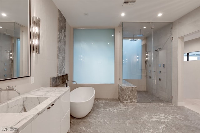 1491 Reims Dr, Henderson, NV 89012 - bathroom with a shower stall, a soaking tub, vanity, marble finish flooring, and recessed lighting