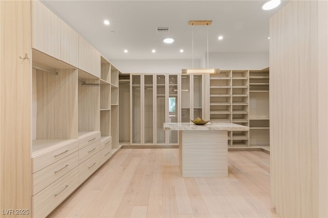 1491 Reims Dr, Henderson, NV 89012 - walk in closet featuring light wood finished floors