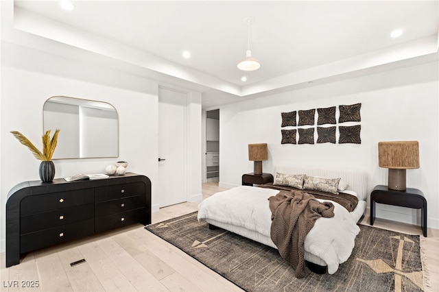 1491 Reims Dr, Henderson, NV 89012 - bedroom with a tray ceiling, recessed lighting, and light wood finished floors