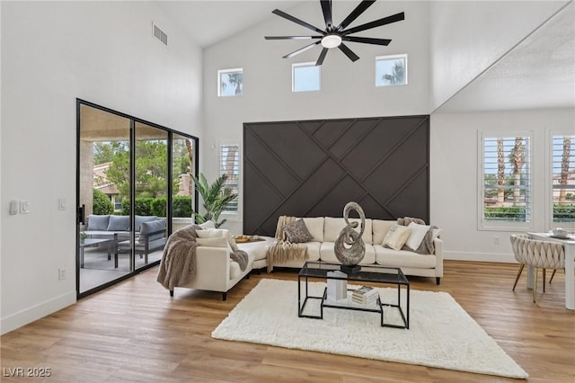 9900 Summer Ash Ct Unit 103, Las Vegas, NV 89134 - living room with high vaulted ceiling, a ceiling fan, and wood finished floors