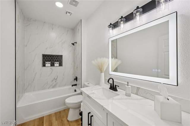 9900 Summer Ash Ct Unit 103, Las Vegas, NV 89134 - bathroom featuring vanity, wood finished floors, and  shower combination