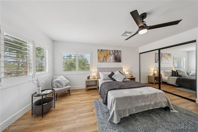 9900 Summer Ash Ct Unit 103, Las Vegas, NV 89134 - bedroom with light wood finished floors, a ceiling fan, and a closet