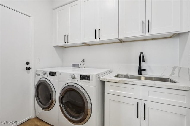 9900 Summer Ash Ct Unit 103, Las Vegas, NV 89134 - laundry room featuring washing machine and clothes dryer and cabinet space