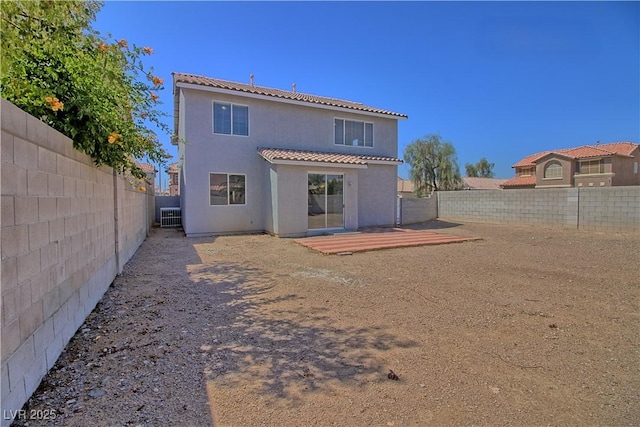 6042 Thorne Bay Ct, Las Vegas, NV 89110 - rear view of house with stucco siding, a fenced backyard, and a tiled roof