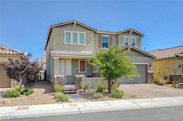 2940 Duverney Ave, Henderson, NV 89044 - craftsman inspired home featuring stucco siding, decorative driveway, and stone siding