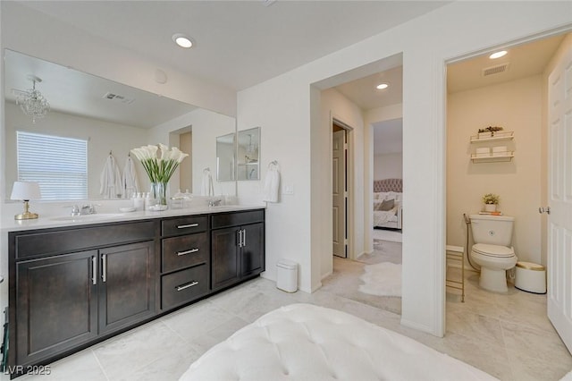 2940 Duverney Ave, Henderson, NV 89044 - ensuite bathroom with double vanity, tile patterned floors, and recessed lighting