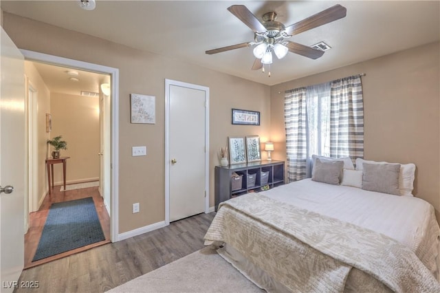 5687 Harbour Pointe Ave, Las Vegas, NV 89122 - bedroom with wood finished floors and a ceiling fan