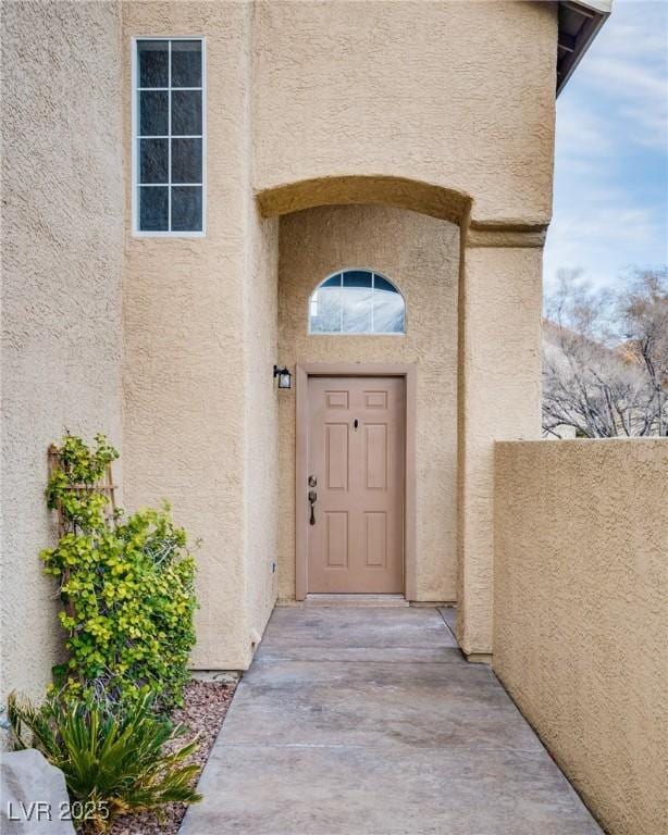 7816 Calico Flower Ave, Las Vegas, NV 89128 - property entrance with stucco siding